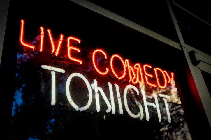 Sign advertising comedy club