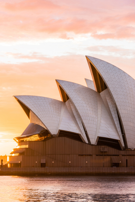 Sydney, Australia - March 25, 2018: Sydney Opera House close-up view with sunrise sky on the background