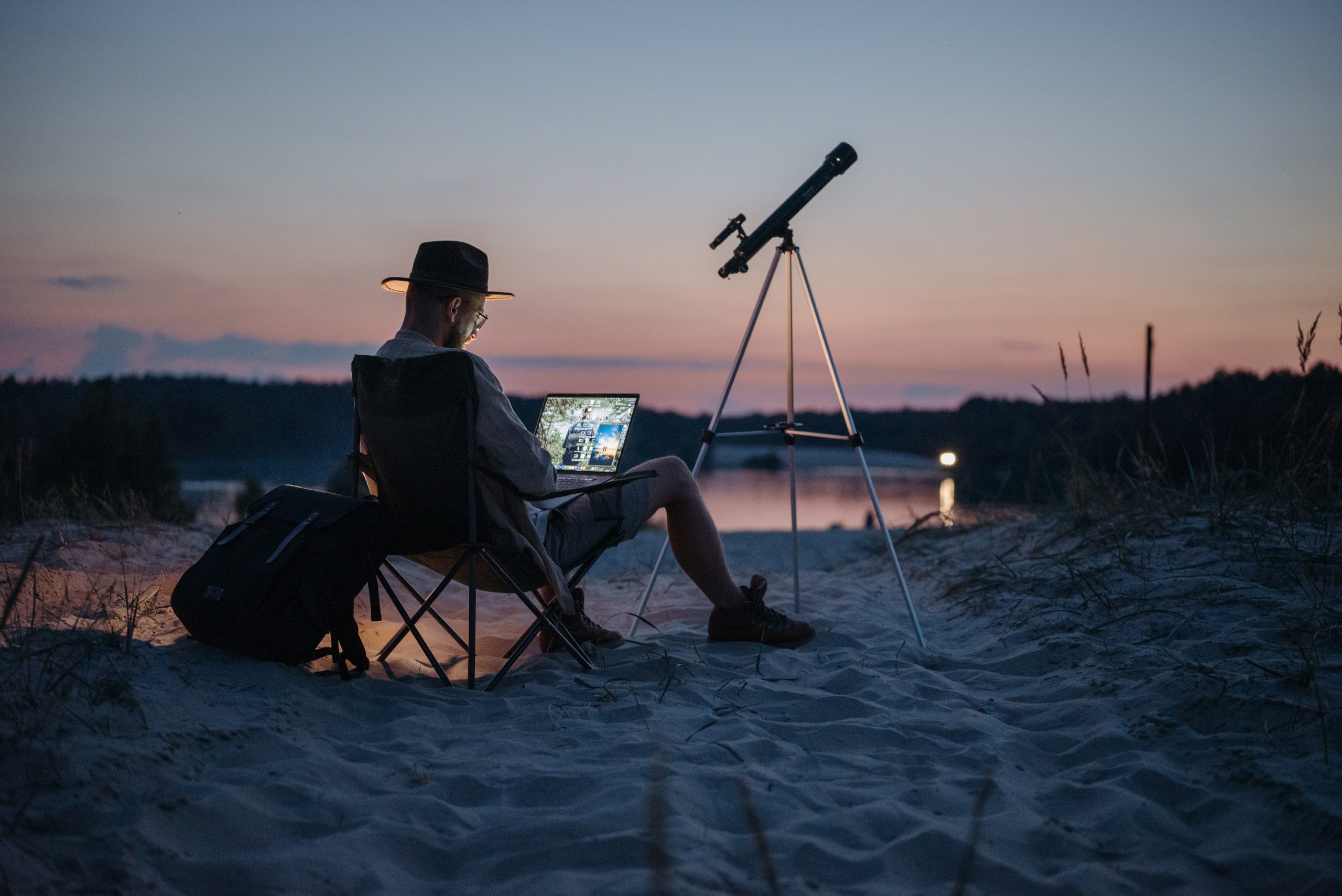 a man using a telescope for work